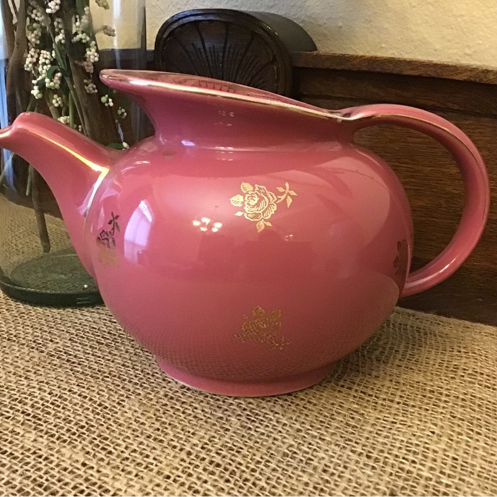 Hall Pottery pitcher. Deep rose with gold trim and floral. Vintage